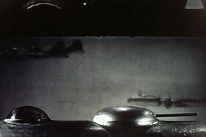 Machine gun of B-29 positioning upwards while flying in a formation - 1945