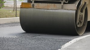 Tracked Pavers Laying Asphalt