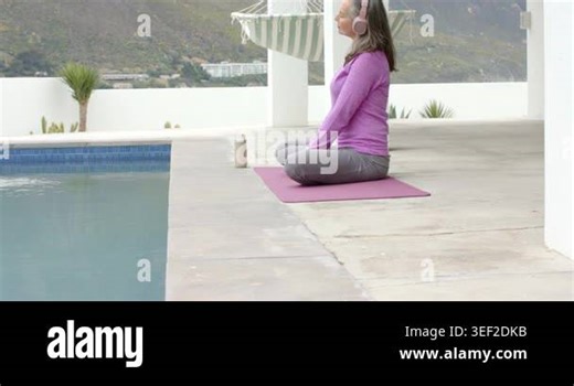Unfolding pink yoga mat at poolside, senior Asian woman is practicing deep breathing for meditation. Meditation, mindfulness, tranquility, wellness, outdoor, serenity, relaxation Stock Video Footage - Alamy