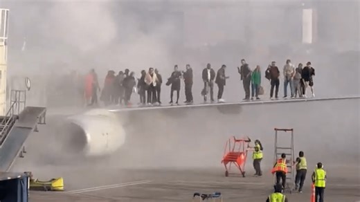 Denver airport fire: See American Airlines passengers escape onto plane’s wing