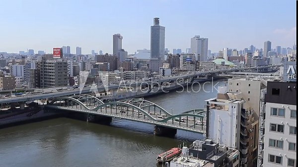 View landscape building office tower architecture cityscape of Taito city with traffic road bridge crossing sumida river for japanese people travelers visit at Asakusa on July 21, 2025 in Tokyo, Japan