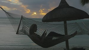 Woman relaxing in a hammock - Free Stock Video