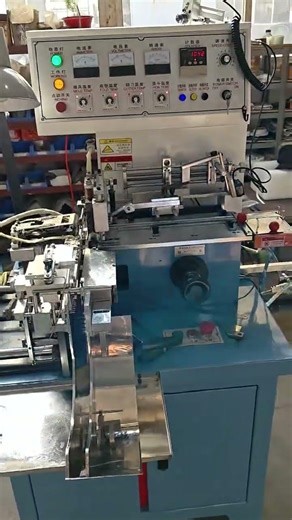New YS-3200 automatic woven fabric clothing label cutting and centre folding machine ready for 2026