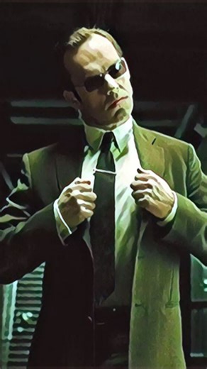 1.3K views · 1.6K reactions | Did you notice in 'The Matrix Reloaded', the suits worn by agents are slightly green inside the Matrix? But Agent Smith has evolved, so his suit is now black. It's not going to end well for those other agents! -- #moviedetails #moviefacts #movietrivia #filmfacts #filmgeek #thematrix | These Movie Facts | Facebook