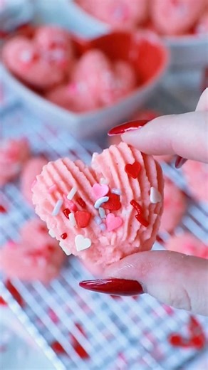 These pink, heart-shaped spritz butter cookies are perfect for Valentine’s Day! This recipe for butter cookies has been in my family for decades and never disappoints! These soft butter cookies are made with butter, sugar, eggs, and a secret ingredient – mayonnaise! It makes the cookies extra soft and delicious! Add some Valentine’s Day sprinkles on top to make the cookies look extra special for the holiday! Get all the recipe details and watch my full-length YouTube video tutorial on my website