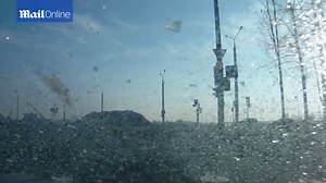 Driver gets shock when ice falls onto car from moving lorry