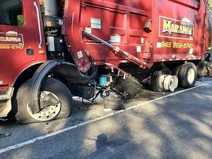 4 Injured When Garbage Truck and SUV Crash