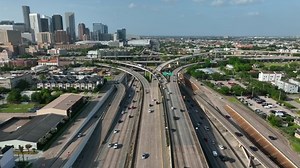 clip-1092519489-downtown-houston-interstate-traffic-aerial-drone-view