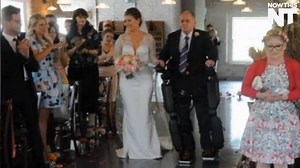 Thanks to a bionic suit, this father left his wheelchair and walked his daughter down the aisle | NowThis