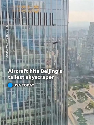 An aircraft about the size of a car crashed into Beijing's tallest building, the CITIC Tower, as police closed off roads around the skyscraper and stopped passersby from filming the scene. #beijing #china