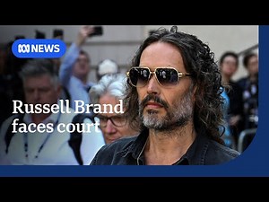 British comedian Russell Brand granted conditional bail on rape charges | ABC NEWS