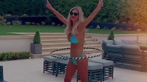 Christine McGuinness strips down to tiny bikini while hula hooping