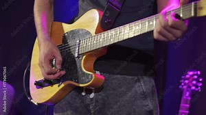 Man playing guitar rock concert. Male Hands Playing of Guitar on The Party. Close up of fingers playing an electric guitar. Concept musical theme. 4K