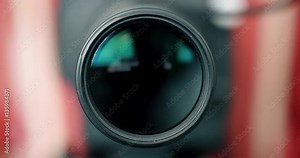Photographer Zooming Camera Lens & Coming into Focus