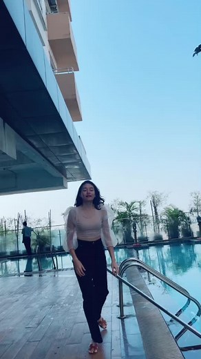 Walking Poolside: A Stylish Stroll in Sheer Tops