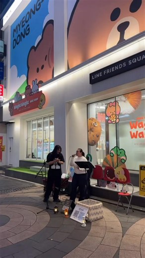 Jamming on the vibrant streets of Myeongdong in Korea was one of the best moments of our vacation — the energy, the music, and the crowd made it an unforgettable experience filled with joy and rhythm.🎵 | Karla Estrada