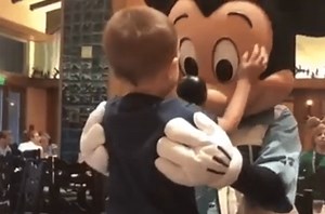 Little boy meets Mickey Mouse 'in real life' for the first time