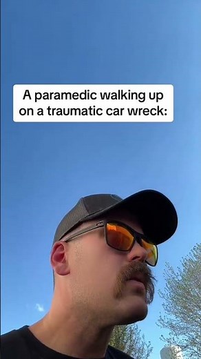 Paramedic walks up on a wreck