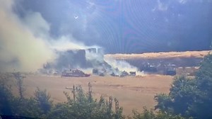 Crews continue to battle hay bale fire in Delaware City. | First State Update