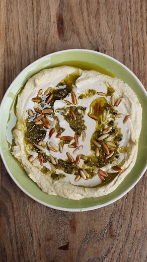 Yotam Ottolenghi on Instagram: "Tahini and green shattah hummus.. this is a really simple topping for your hummus. Excellent for dunking and scooping with pita! My go-to hummus recipe and a few toppings are via my link in bio."