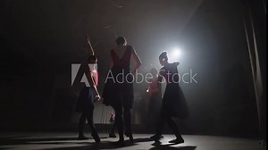 Beautiful and gentle ballerinas dance together in a performance in a ballroom. The ballet troupe practices and trains together, honing dance moves. High quality 4k footage