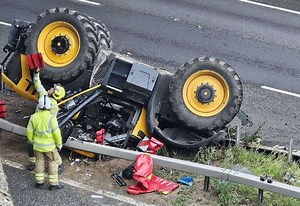 Tractor driver ‘critical but stable’ after vehicle fell from bridge onto M20