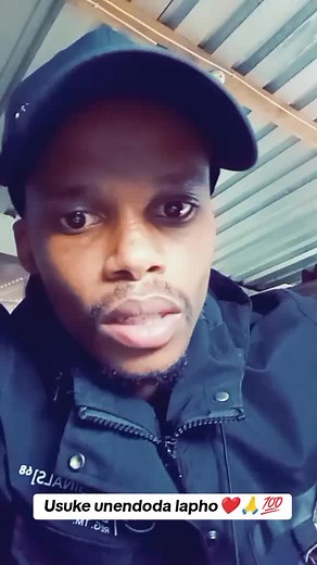 Casual Style: Close-Up of Dark Jacket and Cap