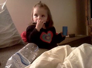 Little Girl Loves to Play the Harmonica