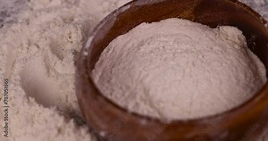 white wheat flour on the table, an ingredient for making bread and other products white wheat flour