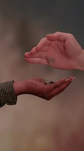 A Beautiful Open Hand Gesture Displayed Against an Abstract Background of Colors and Shapes