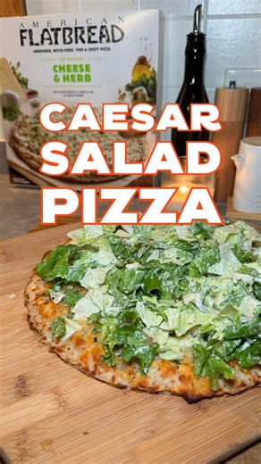 The perfect Caesar Salad Pizza! Our Cheese and Herb Pizza makes the perfect base for a Caesar Salad Pizza. Bake at 425 for 5-8 minutes then top with fresh romaine, Parmesan cheese and your favorite caesar dressing. An easy recipe for any night of the week! 🥗🍕 #eatamericanflatbread #frozenpizza #easyrecipes #weeknightdinner #caesarsaladpizza | American Flatbread Frozen Pizza