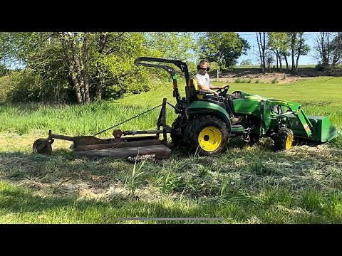 #8 John Deere 2025r with a 5 foot Bush Hog. Cutting down the tall grass on our property PART 1