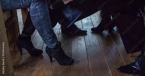 A man is touching a lady's leg with his foot when she is sitting across from him during a business meeting. Close-up shot. Stock Video
