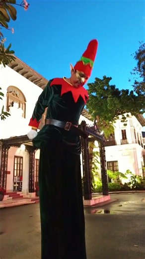 men on stilts elf costume
