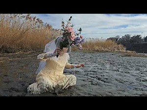 Playing in the mud in a wedding dress2