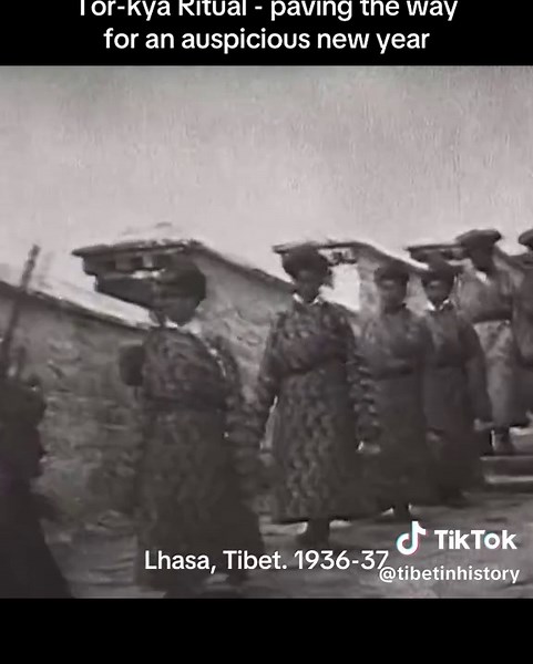 Monks and Tibetan government officials walk down the steps of the Potala Palace for the conclusion of the Torkya ritual, which takes place in front of the palace. The audio was added later for reference, but it gives an idea of how the ceremony would have sounded. _ The Torkya figure is created to attract and represent negative forces and obstacles. It is then thrown into a large bonfire known as the “wisdom fire” symbolizing the wisdom that purifies and consumes all negativity, paving the way f