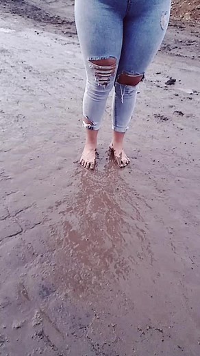 Barefoot Fun: Walking Through Muddy Puddles