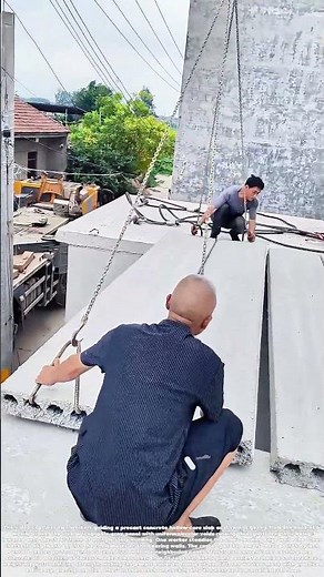 Hoisting the Hollows: How Two Workers Lift Precast Slabs Into Place