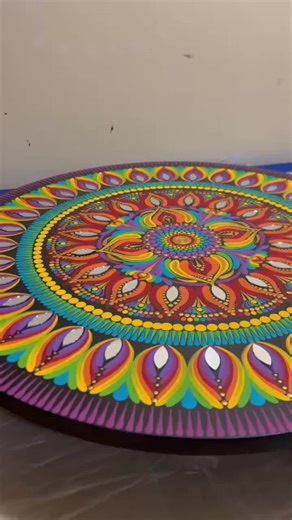We don’t use epoxy just because it’s shiny. We use it because these pieces are meant to be lived with. 🌈✨ Epoxy protects the paint, deepens the color, and gives this table a durable, wipeable, built-to-last finish. No fading. No flaking. Just strength and glow. Mandala art doesn’t belong on a wall only. It belongs in your home, holding coffee cups, hosting conversations, and standing the test of time. This rainbow isn’t just pretty. It’s sealed for real life. 🔥 #TheDottingCottage #EpoxyFinish 