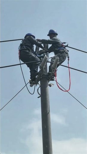 Power Linemen Installing High-Voltage Lines on a Utility Pole !