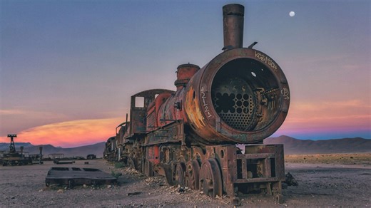Inside train graveyard where Brit engines & carriages are rusting in the desert