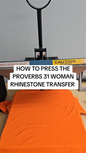 How to Press the Proverbs 31 Woman Rhinestone Transfer. What color would you put this on? #rhinestonetshirt #fyp #naleava #rhinestonetransfer #howto | Nale & Ava LLC