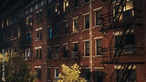 Establishing Shot: 3D VFX Animated Brick Multi-Storey Apartment Building. Twentieth Century Brownstone House. Urban Landscape During Night Time of a House with Emergency Stairs and Street Lighting.