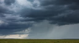 Timelapse of dark storm cell clouds forming in the open plains of...
