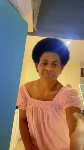 Stylish Pink Dress in a Modern Kitchen Setting