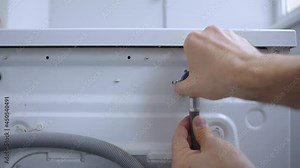 Connecting and installing cold water supply hose to back of the washing machine