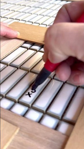 Using a template to cut and install a shower pan mosaic tile #diy #tiled #tile #tiling #construction