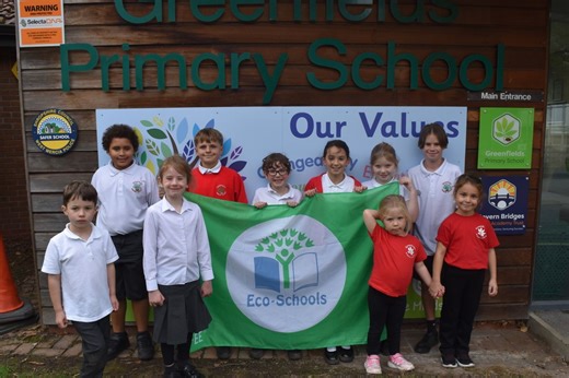 Sustainability champions: pupils at Greenfields Primary School receive Eco-Schools Green Flag recognition