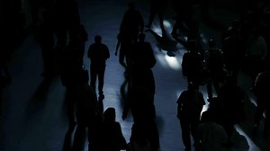 Pedestrians walking on crowded urban street commuting to work