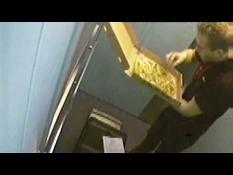 Pizza man eats toppings off one of his deliveries